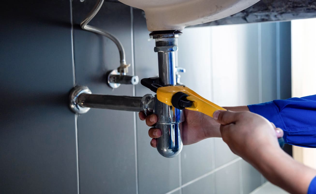 Plumbing Working on Sink Pipe